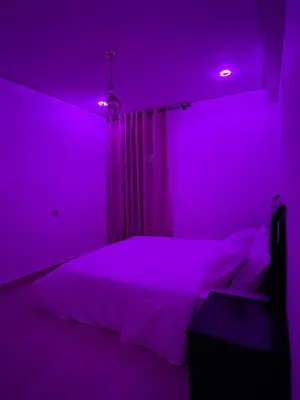 a purple bedroom with a bed and a purple light at Modern Apartment with Fully Equipped Kitchen Perfect Location in Marrakech in Marrakech