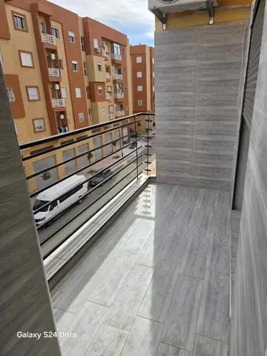 a view from the top of a balcony of a building at Cozy Apt Near Marrakech Airport in Marrakech