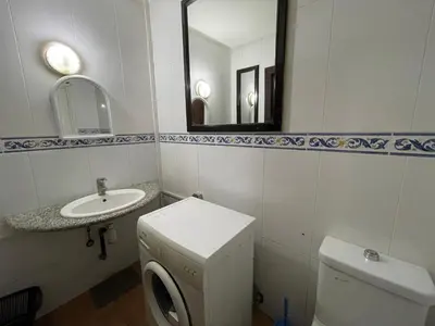 a bathroom with a toilet and a sink and a mirror at Le grand jardin Marrakech in Marrakech