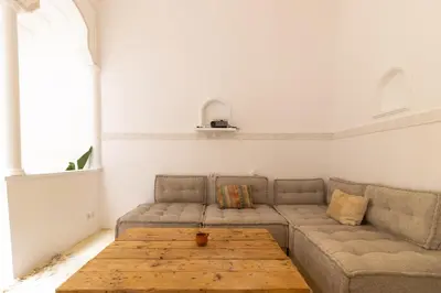 a living room with a couch and a wooden table at HM40 I Moroccan Riad with Residential Pool in Marrakech