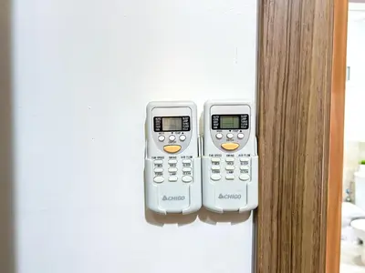 two remote controls are hanging on a wall at Apartment in City Center - Gueliz in Marrakech