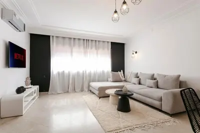 a living room with a couch and a table at Place To Be Marrakech Downtown in Marrakech