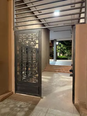 a door in a building with a sign on it at N17 Agréable Confortable & Près De Gueliz in Marrakech