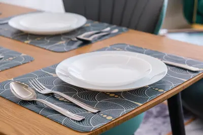 two white plates and silverware sitting on a table at 2BR Modern Apt 2min M Avenue Balcony Fiber WiFi 2 Pools 24 7 Security Hivernage in Marrakech