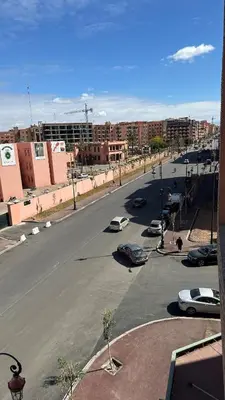 a city street with cars parked in a parking lot at Top apartment Great location in Marrakech
