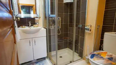 a bathroom with a shower and a sink and a toilet at Marrakech Luxury apartment in Marrakech