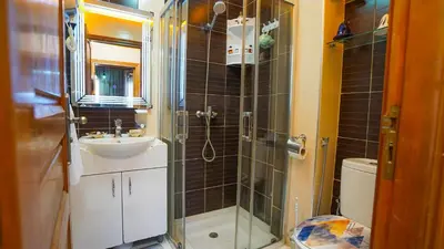 a bathroom with a shower and a sink and a toilet at Marrakech Luxury apartment in Marrakech
