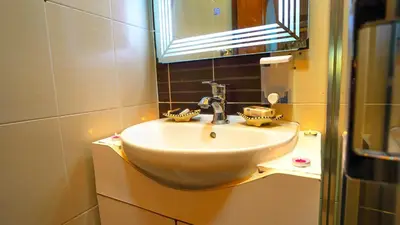 a bathroom with a white sink and a mirror at Marrakech Luxury apartment in Marrakech