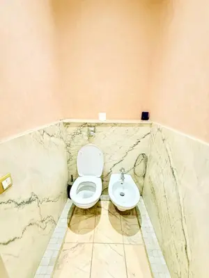 a bathroom with a toilet and a sink at VILLA 34 - 4 Masters, Moroccan Charm & Modern Comfort with Private Pool in Marrakech
