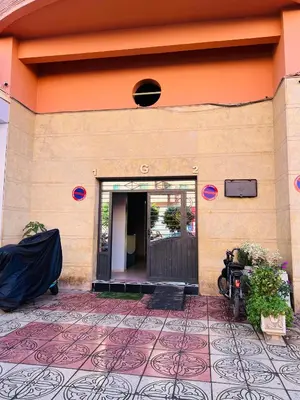 a front door of a building with a tile floor at Apartment Msholidays 1 CH Marrakech pool in Marrakech