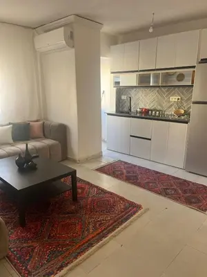 a living room with a couch and a coffee table at Au cœur de la ville ocre in Marrakech