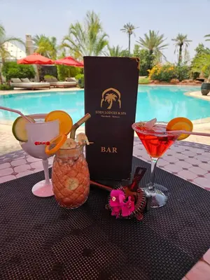 a table with a bar and two drinks on it at Eden Lodges & SPA-Boutique Hôtel de Luxe in Marrakech