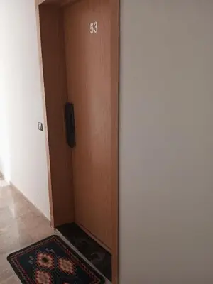 a room with a door with a television on it at Charming Marrakech apartment in Marrakech
