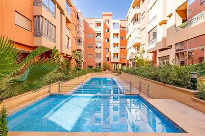 a swimming pool in the middle of a building at Stylish Cozy Appartement in marrakech with Pool in Marrakech