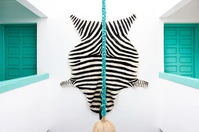 a zebra hanging on the side of a building at Luxury Riad, Marrakech, Pool, Free Airport Shuttle, Dar Bassidi in Marrakech