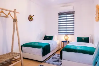 a bedroom with two beds and a ladder at Luxury Riad, Marrakech, Pool, Free Airport Shuttle, Dar Bassidi in Marrakech