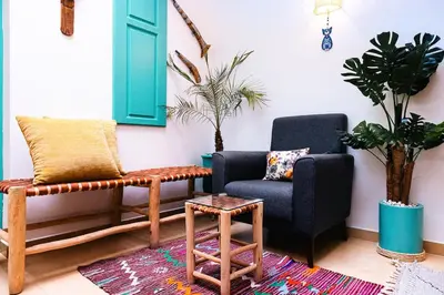a living room with two chairs and a table at Luxury Riad, Marrakech, Pool, Free Airport Shuttle, Dar Bassidi in Marrakech