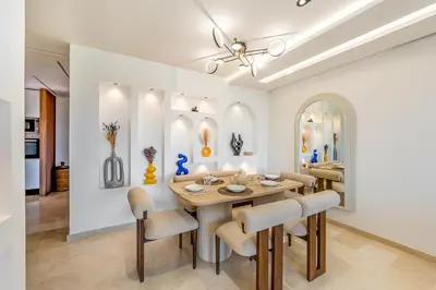 a dining room with a table and chairs at Luxury Saphir- Golf, piscines & calme in Marrakech