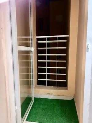 a window in a room with a green floor at Appartement Marrakech in Marrakech