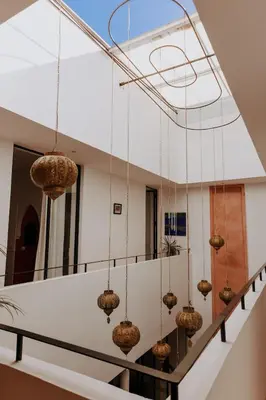 a room with many balls hanging from the ceiling at Riad de charme avec piscine rooftop in Marrakech