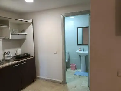 a kitchen with a sink and a bathroom with a toilet at family apartment 06 in Marrakech