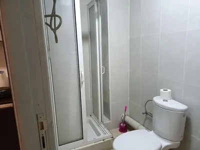 a bathroom with a shower and a toilet in it at family apartment 06 in Marrakech