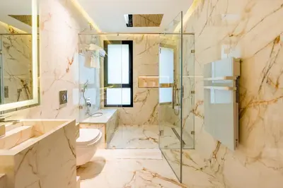 a bathroom with a shower and a toilet and a sink at Luxury Villa Heated Pool, Cinema & Game Room in Marrakech
