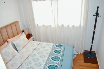 a bedroom with a bed and a window at Appartement Marrakech in Marrakech