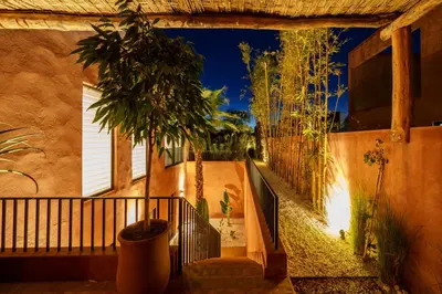 a building with a hallway with a tree in it at Villa Nomade - 4 BR BA - Piscine - Parking - Ourika in Sraghna