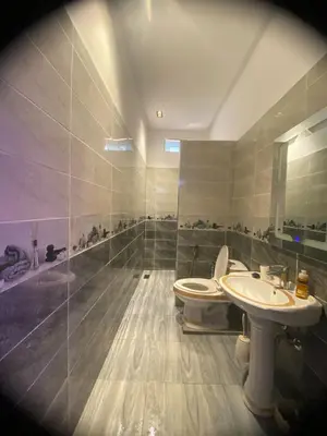 a bathroom with a toilet and a sink at Waha hassan 2 in Marrakech