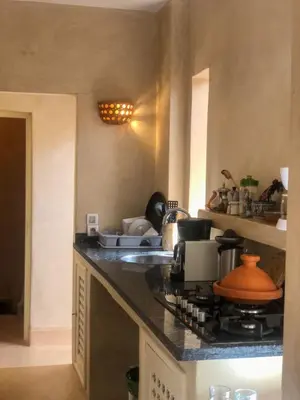 a kitchen with a stove and a counter top at SAMA DABACHI Vibrant Medina Loft and Roof top in Marrakech