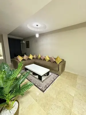 a living room with a couch and a table at apartment 9 imm O in Marrakech
