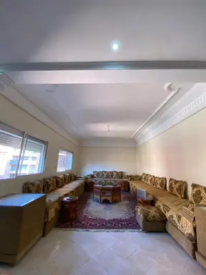 a large living room with couches and a table at Appartement bros in Marrakech