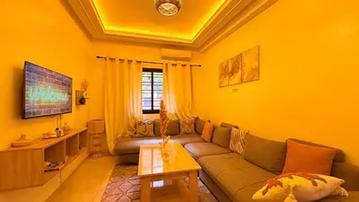 a living room with a couch and a table at Dar sultane in Marrakech