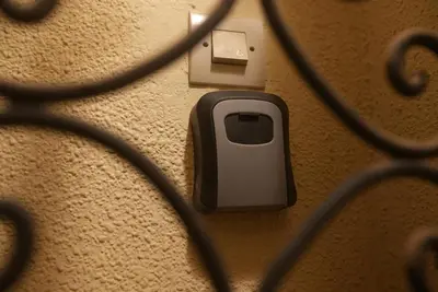 an electrical outlet with a cell phone plugged into it at Dar sultane in Marrakech