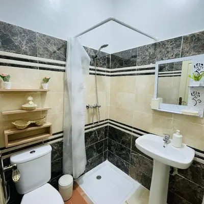 a bathroom with a toilet and a sink at Dar sultane in Marrakech