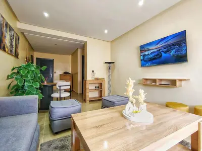 a living room with a couch and a table at Chic & Comfort Apartment in Marrakech