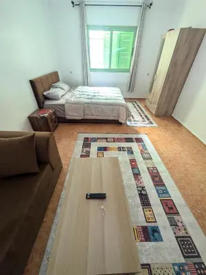 a living room with a couch and a coffee table at Cozy studio in a good location in Marrakech