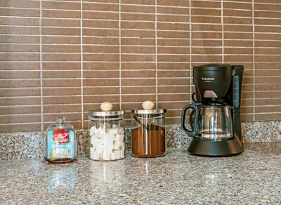 a coffee maker sitting on top of a counter at Luxurious Apartment in Marrakech in Dar Caïd Layadi