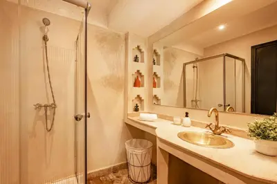 a bathroom with a shower and a sink at Cozy & Stylish Apartment in Marrakech in Marrakech