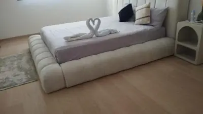 a bed with two swans on it in a room at Villa Rana in Marrakech