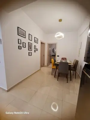 a kitchen and dining room with a table and chairs at Quiet studio in Marrakech