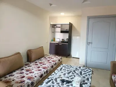 a living room with a couch and a table at family apartment 34 in Marrakech