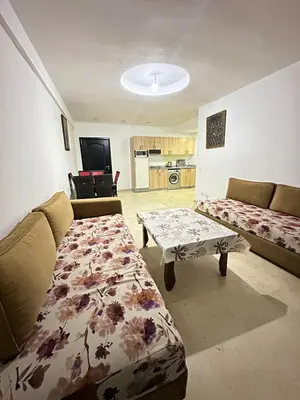 a living room with a couch and a table at family apartment 32 in Marrakech