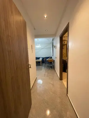 a hallway with a door leading to a dining room at Marrakech Center Getaway Apartment in Marrakech