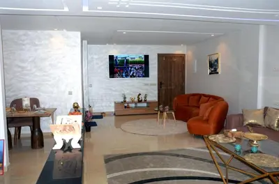 a living room with a couch and a table at Burj malak in Marrakech