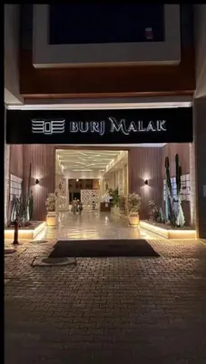 a store front of a building with a sign that reads bullet mall at Burj malak in Marrakech