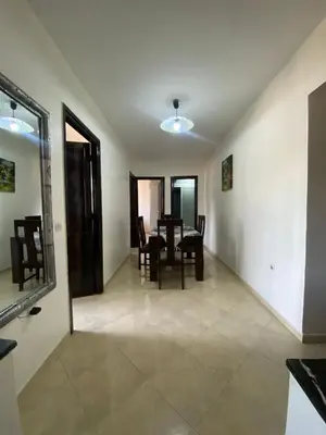 a dining room with a table and chairs at appartement Alaoui in Marrakech
