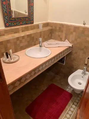 a bathroom with a sink and a toilet at SEJOUR D'EXCEPTION LUXE Et SERENITE MARRAKECH in Marrakech