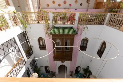 an overhead view of a building with a balcony at Riad Rumi Marrakech Medina in Marrakech